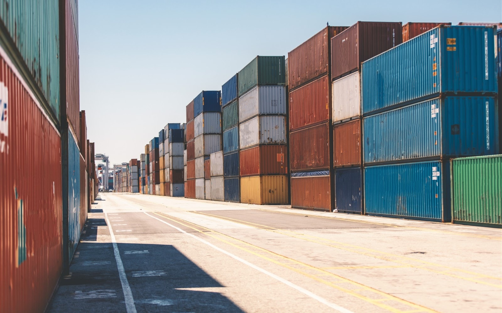 Shipping containers stacked in storage yard