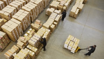 Pallets being moved in warehouse