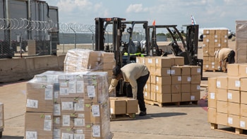 Consolidating consignee pre-labelled packages into one shipment to clear customs fast