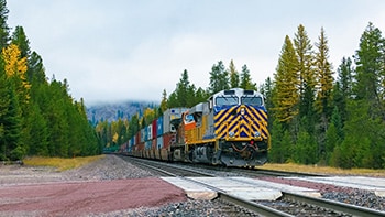 Cross-country freight containers traveling via railroad