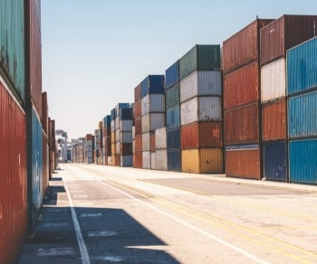 Shipping containers stacked in storage yard