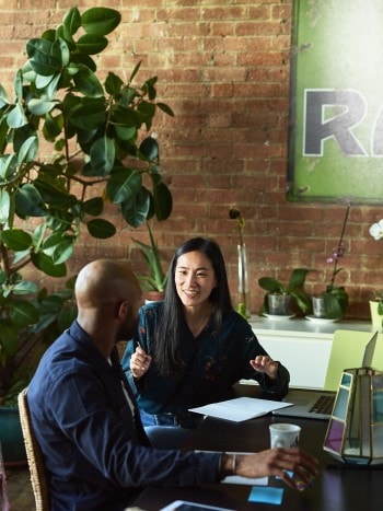 Two workers in office