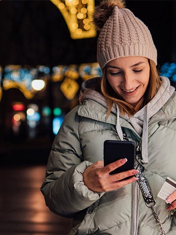 Young woman online shopping on smartphone