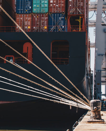 Ocean vessel full of containers docked at port