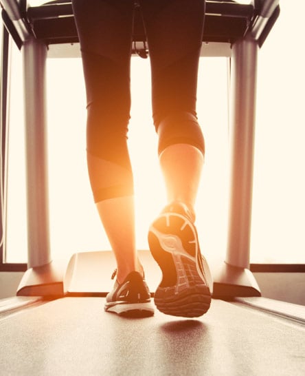 Woman working out on treadmill