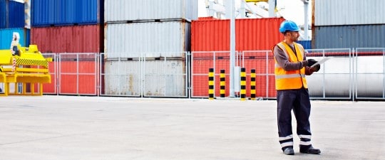 Freight worker in container yard