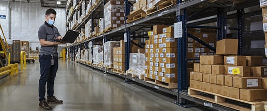 Warehouse worker in mask