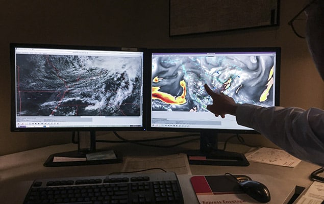 Control center watching storm tracker