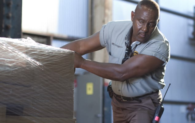 UPS employee handling pallet for LCL shipment