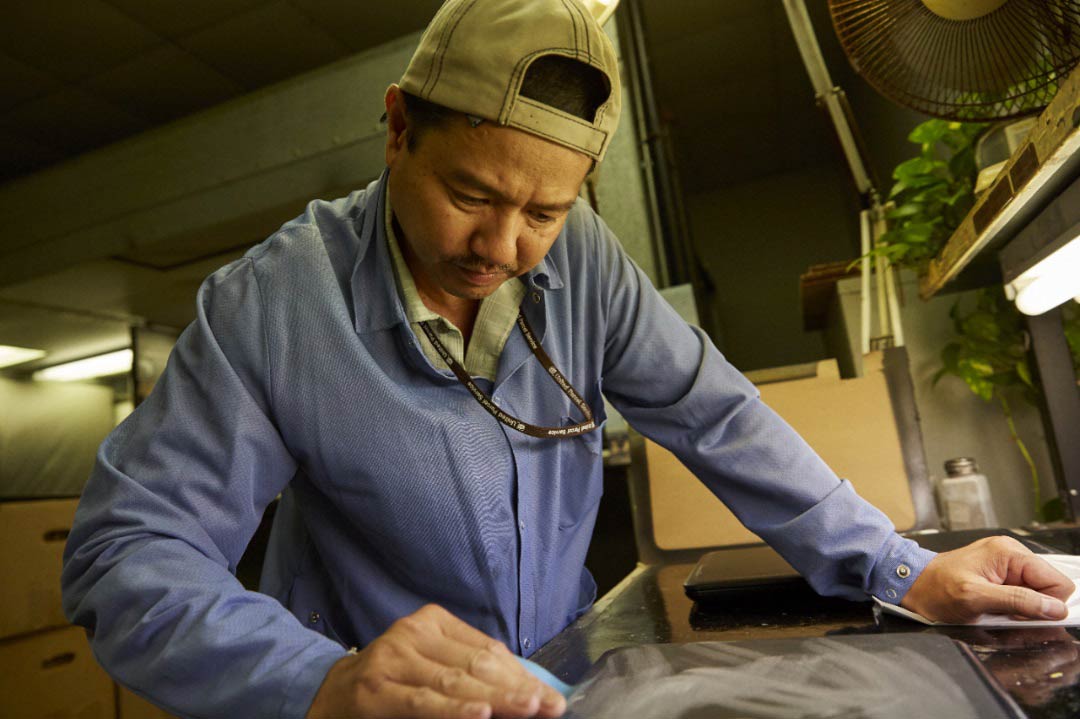 UPS employee providing refurbishment services in distribution center