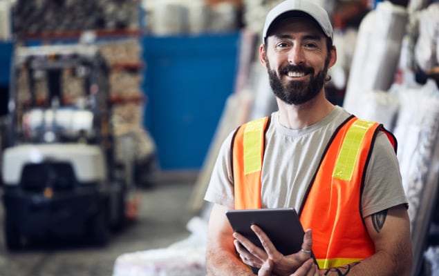 Warehouse employee smiling