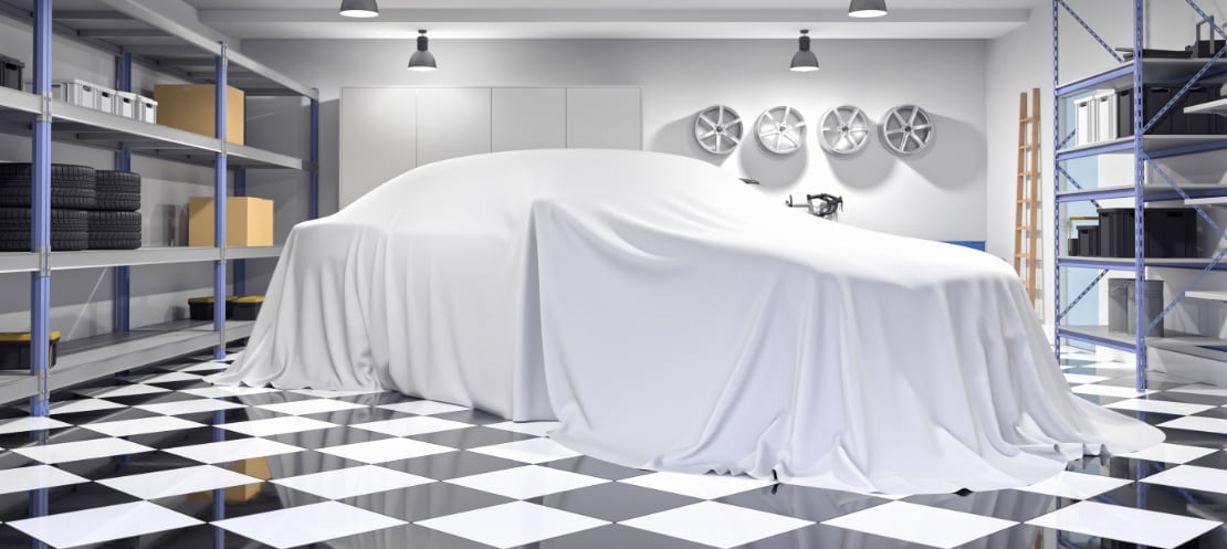 Car under drape on beautiful garage floor