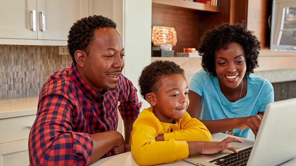 Family looking at computer